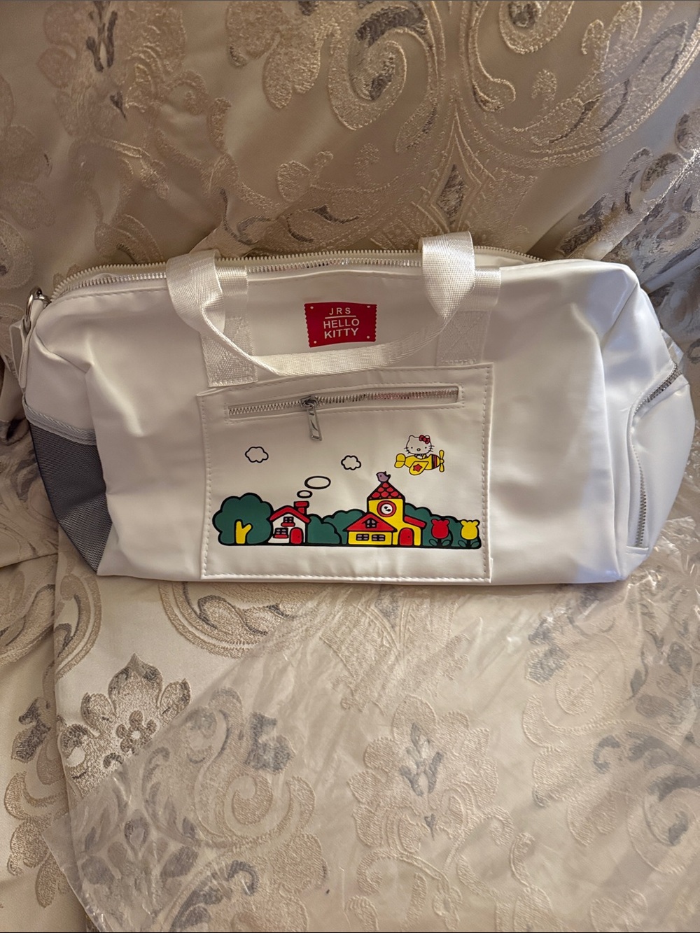 Hello Kitty White Travel Bag with Colorful Village Print